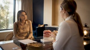 Client consulting doctor about lip filler volume