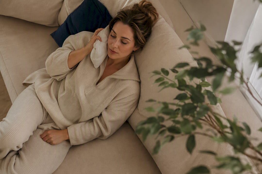 Woman applying cold compress during recovery