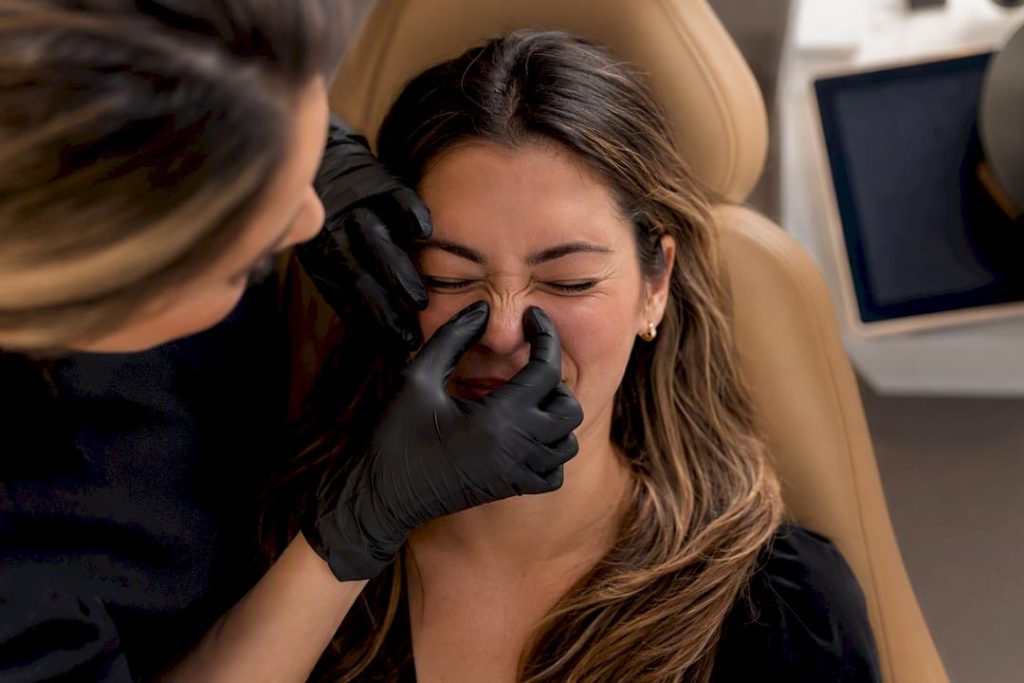 Nurse mapping nasal movement before treatment
