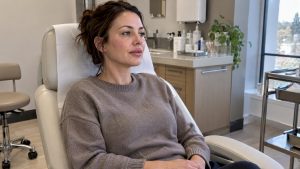 Patient resting after facial filler treatment